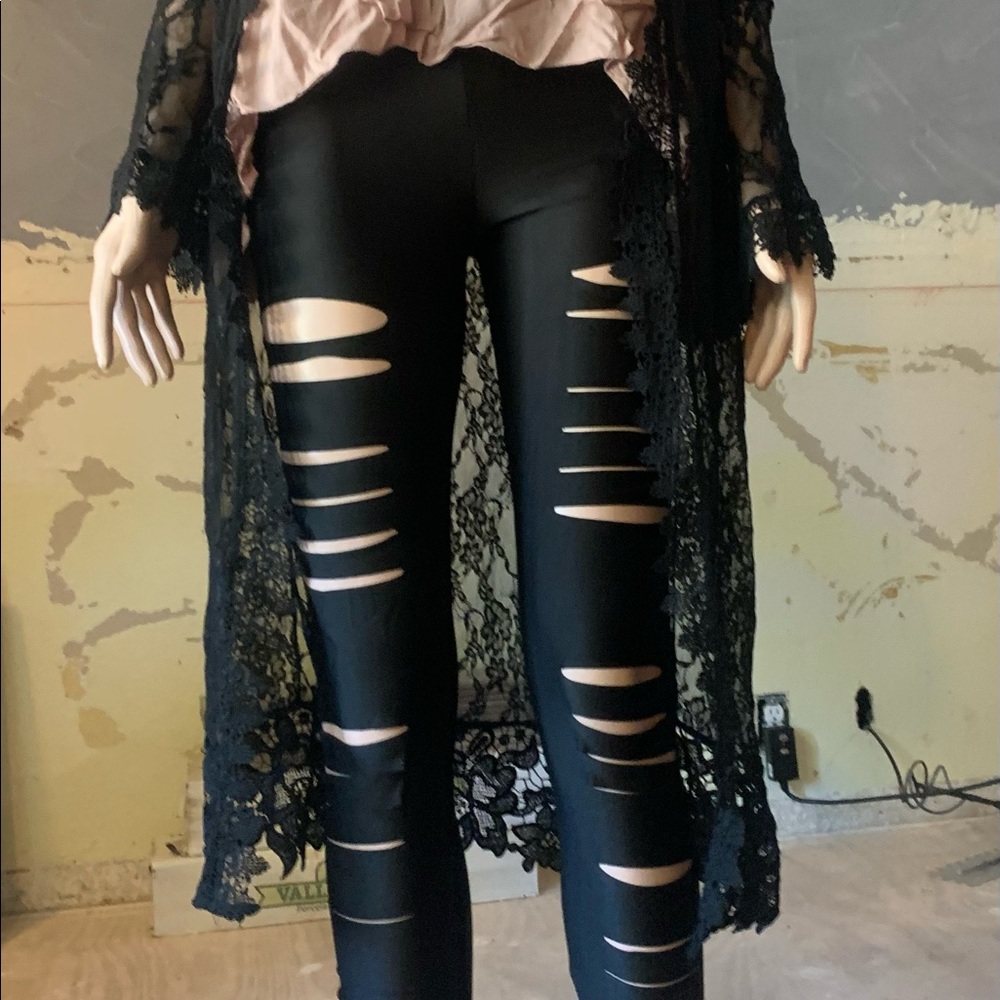 Black shiny cutout leggings. Size small